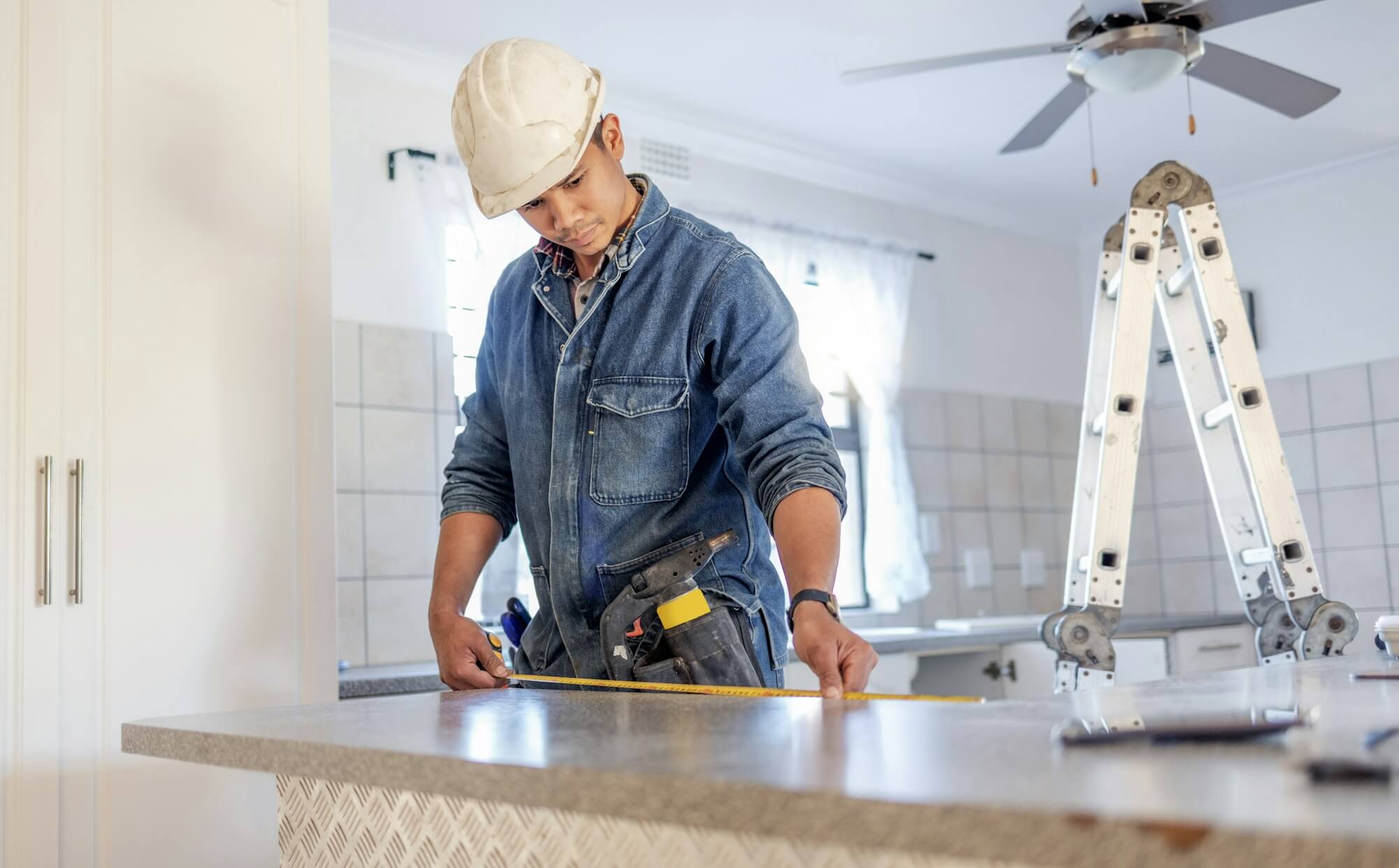 construction-measurement-and-handyman-doing-home-repair-renovation-and-building-a-counter-servic.jpg